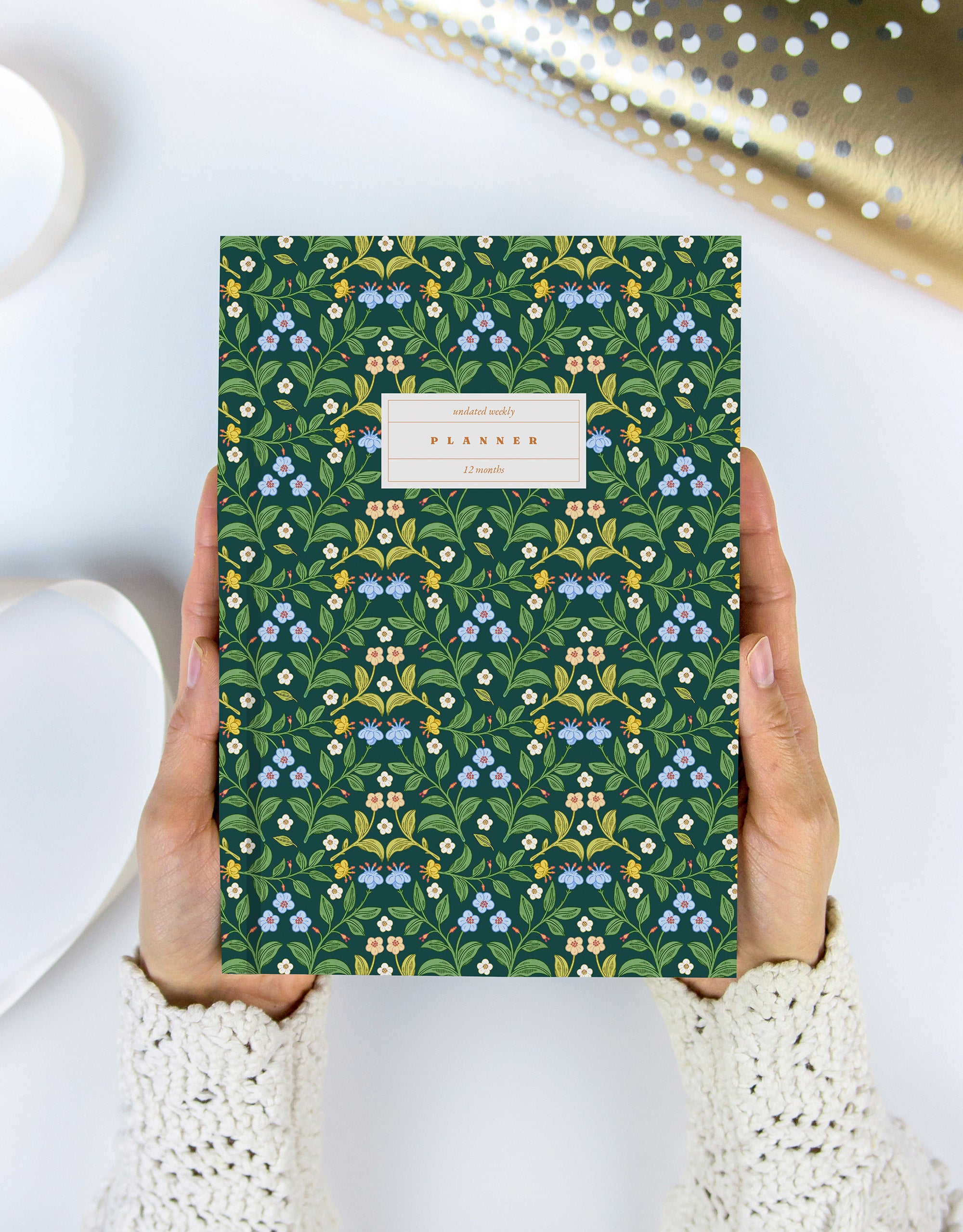 hardcover planner with floral cover illustration