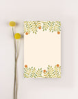 yellow tear off notepad with oranges