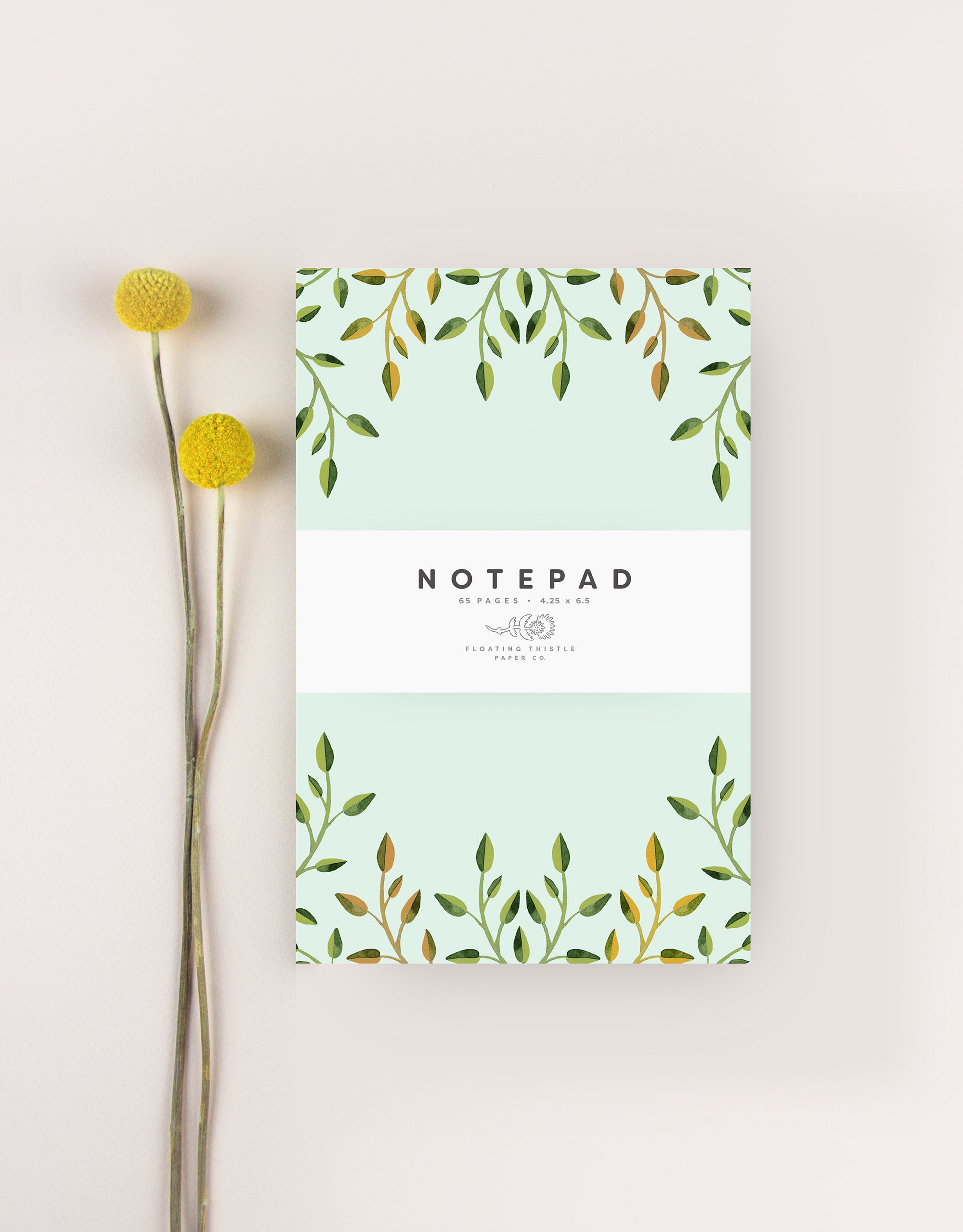 notepad with green leaves
