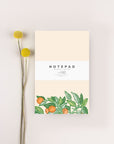 notepad with oranges