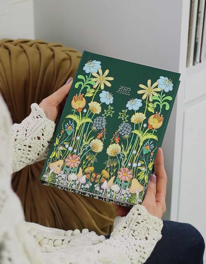 video of 2025 weekly hardcover planner featuring beautiful floral garden illustration 